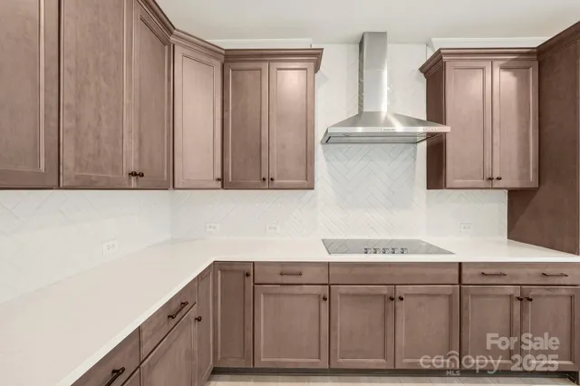 a kitchen with stainless steel appliances white cabinets and a sink