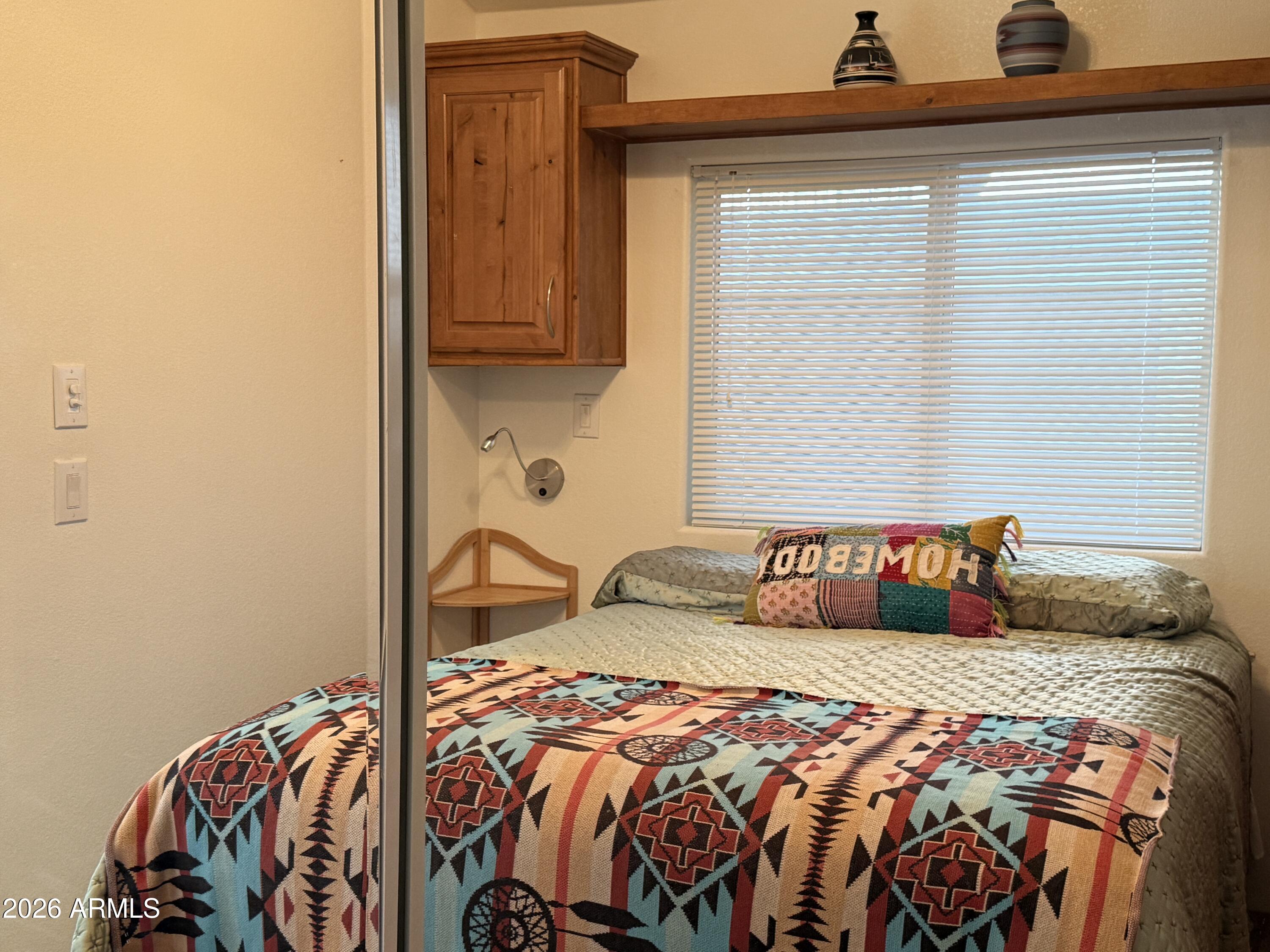 21245 Westward View Road, Unit 248 Congress, AZ 85332 - Photo 15 of 28 a bedroom with a bed and a dresser