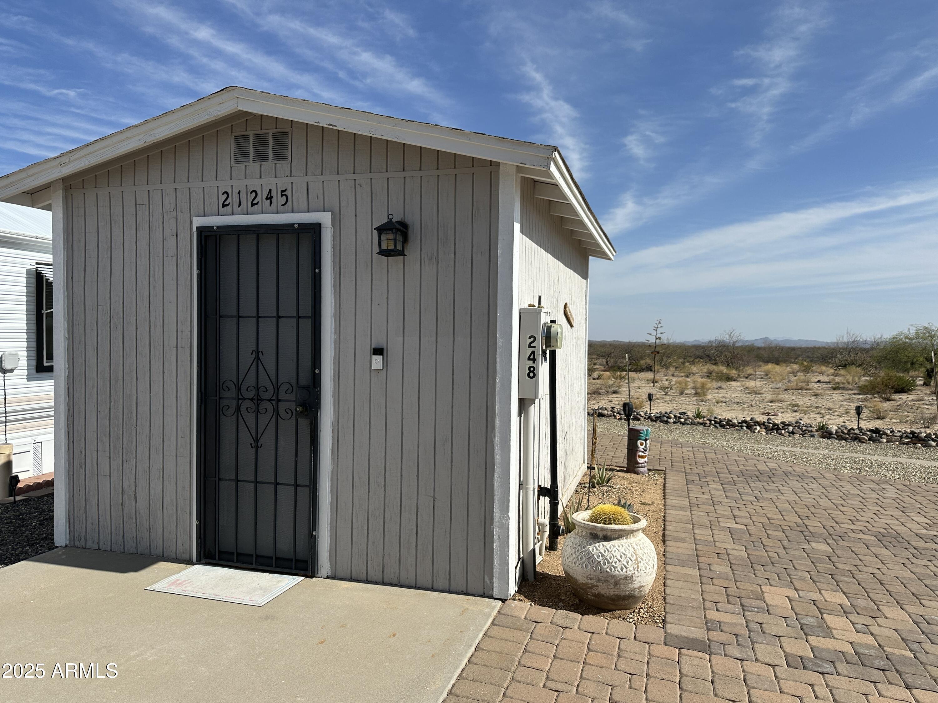 21245 Westward View Road, Unit 248 Congress, AZ 85332 - Photo 21 of 29 Shed and Paver Patios