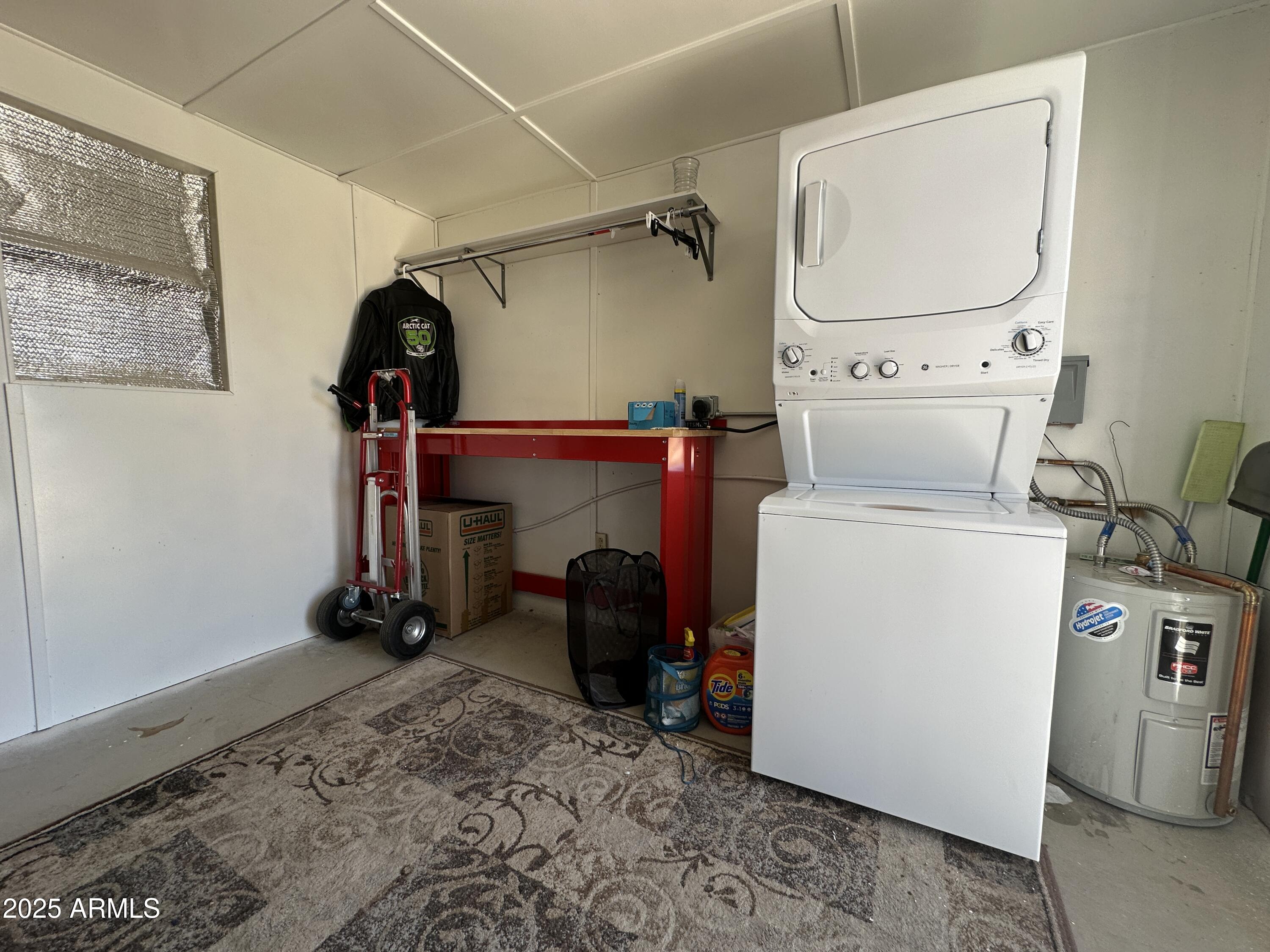 21245 Westward View Road, Unit 248 Congress, AZ 85332 - Photo 22 of 28 a view of storage and utility room with washer and dryer