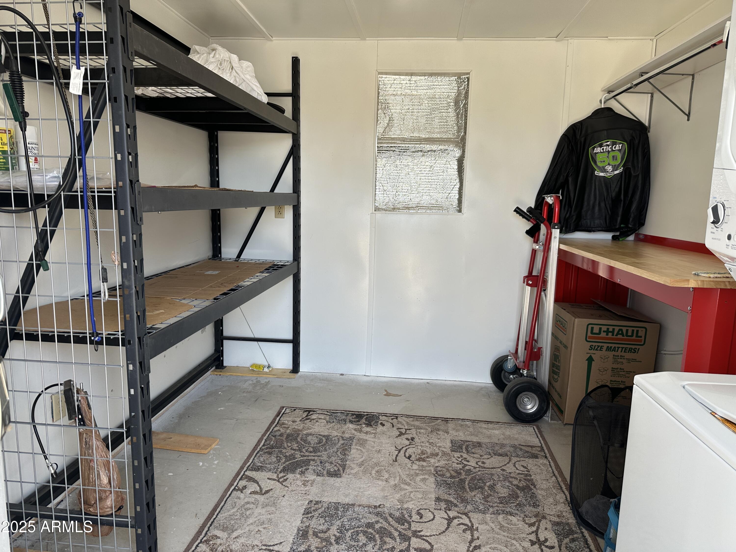 21245 Westward View Road, Unit 248 Congress, AZ 85332 - Photo 22 of 29 Shed interior wth shelving (1)