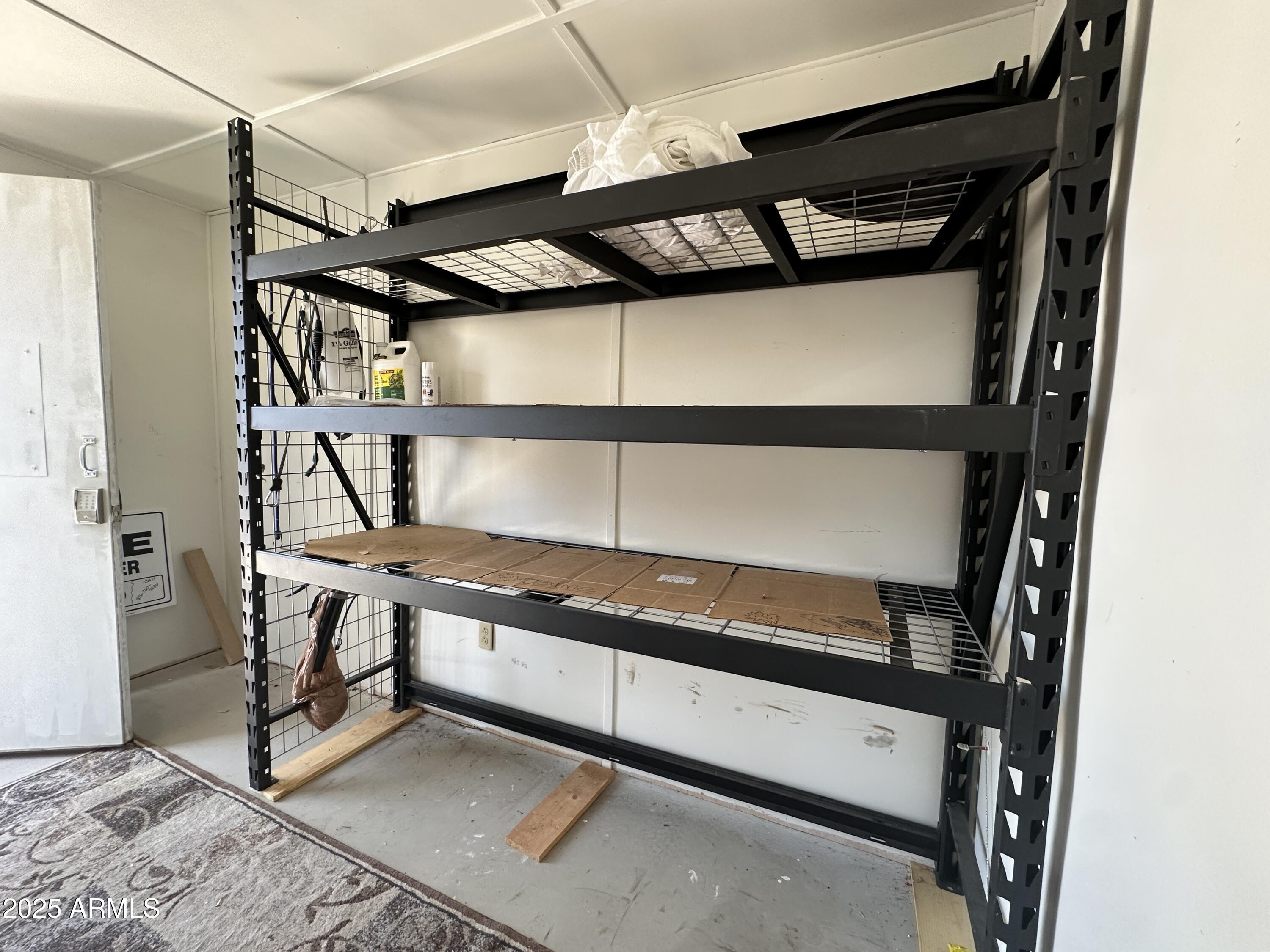 21245 Westward View Road, Unit 248 Congress, AZ 85332 - Photo 23 of 29 Shed interior wth shelving (2)