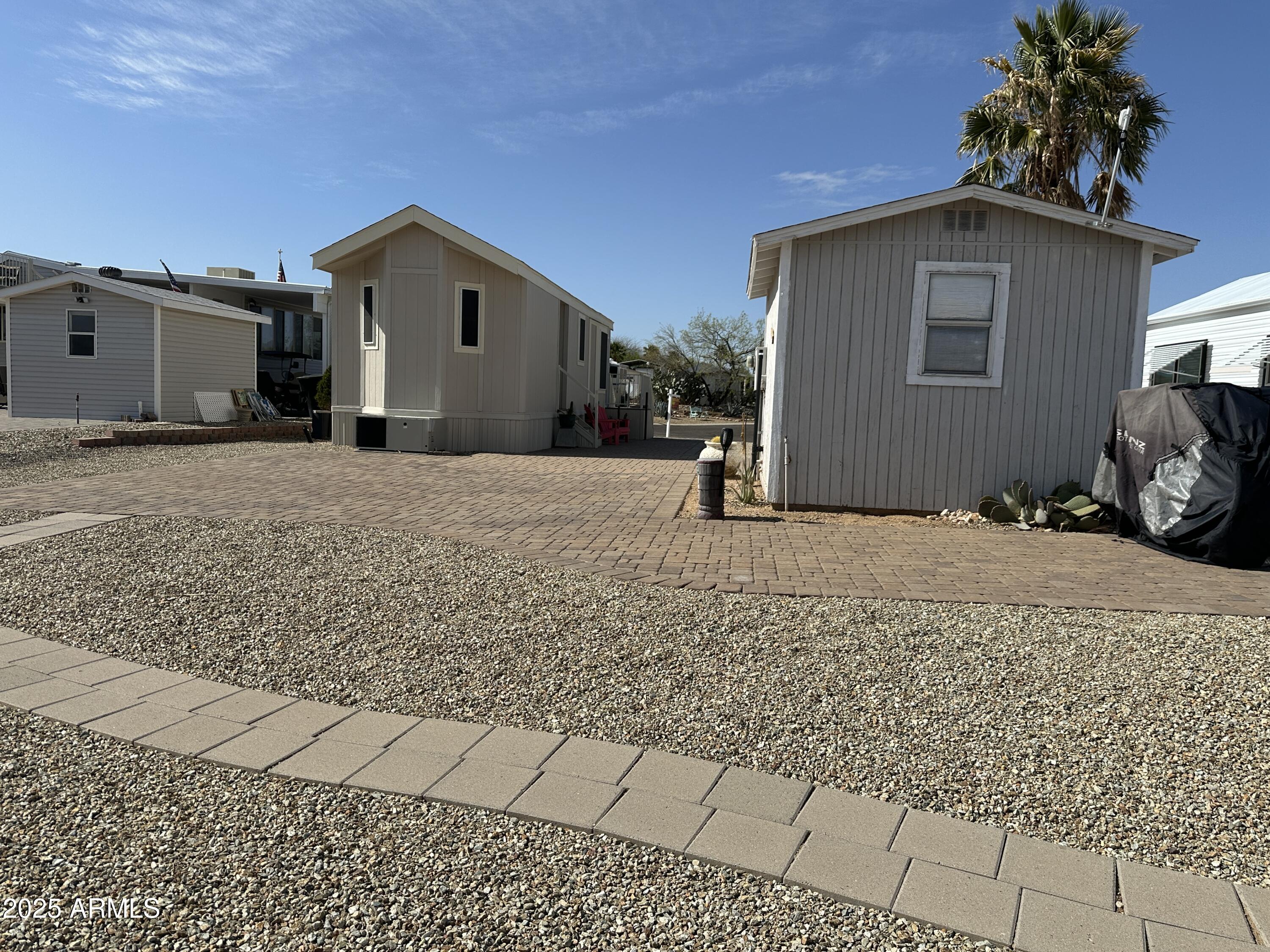 21245 Westward View Road, Unit 248 Congress, AZ 85332 - Photo 25 of 28 a view of a house with a yard