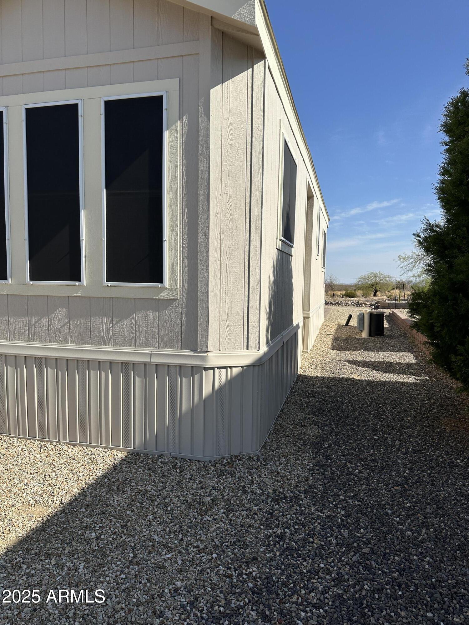 21245 Westward View Road, Unit 248 Congress, AZ 85332 - Photo 28 of 28 a view of a house with backyard and sitting area