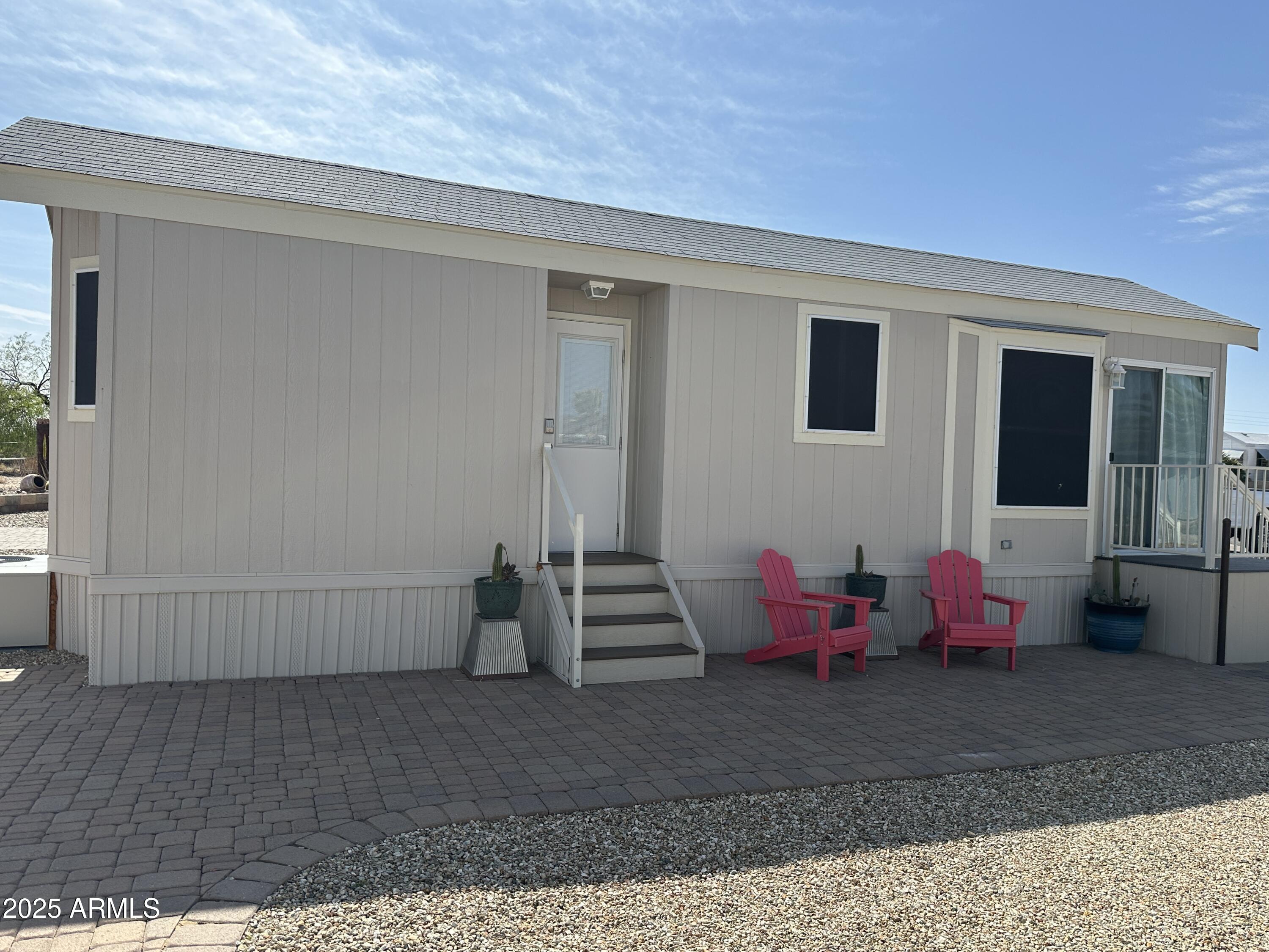 21245 Westward View Road, Unit 248 Congress, AZ 85332 - Photo 7 of 29 Inviting Home Side Paver Patio