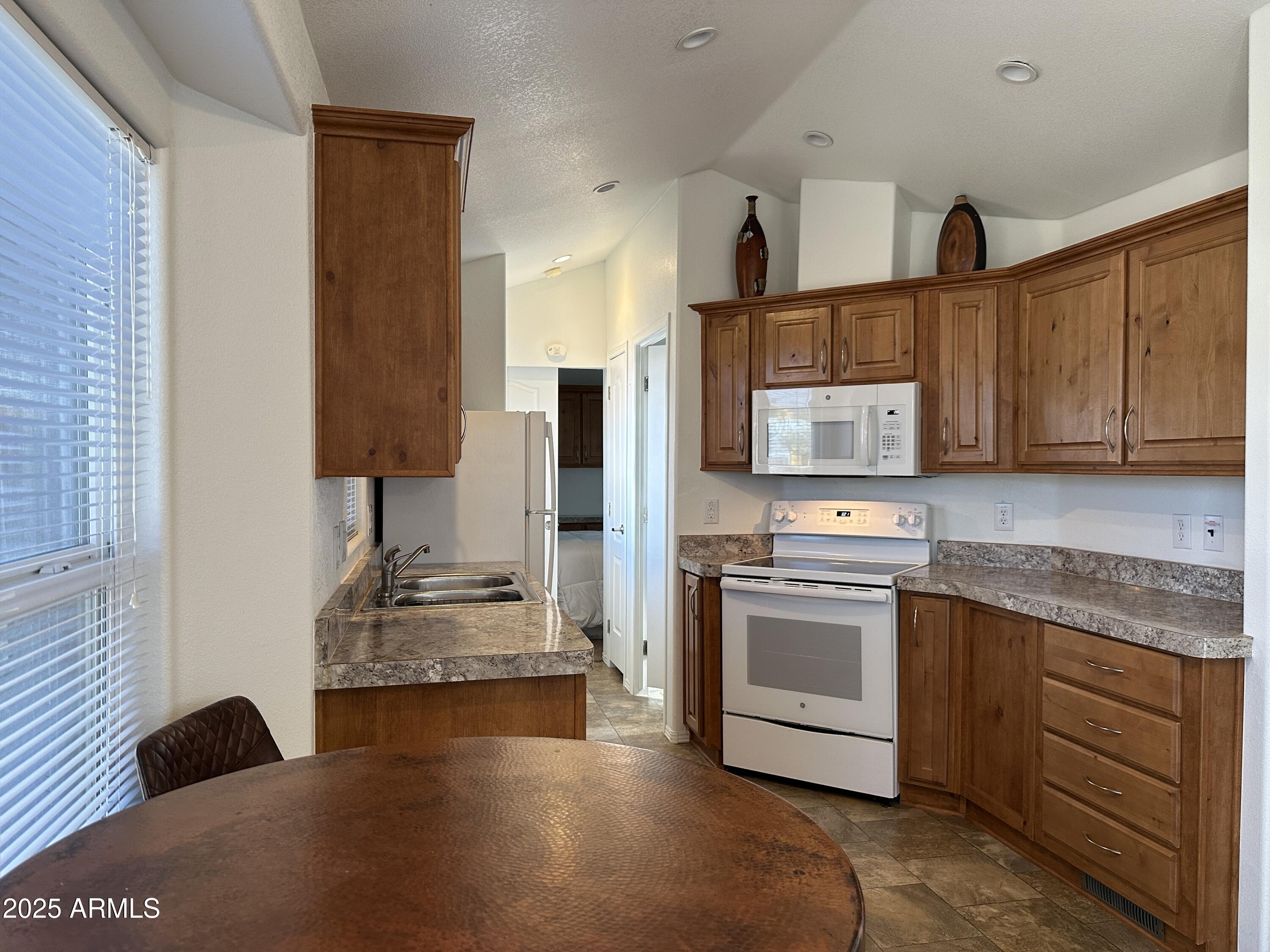 21245 Westward View Road, Unit 248 Congress, AZ 85332 - Photo 9 of 29 Great Room toward Kitchen
