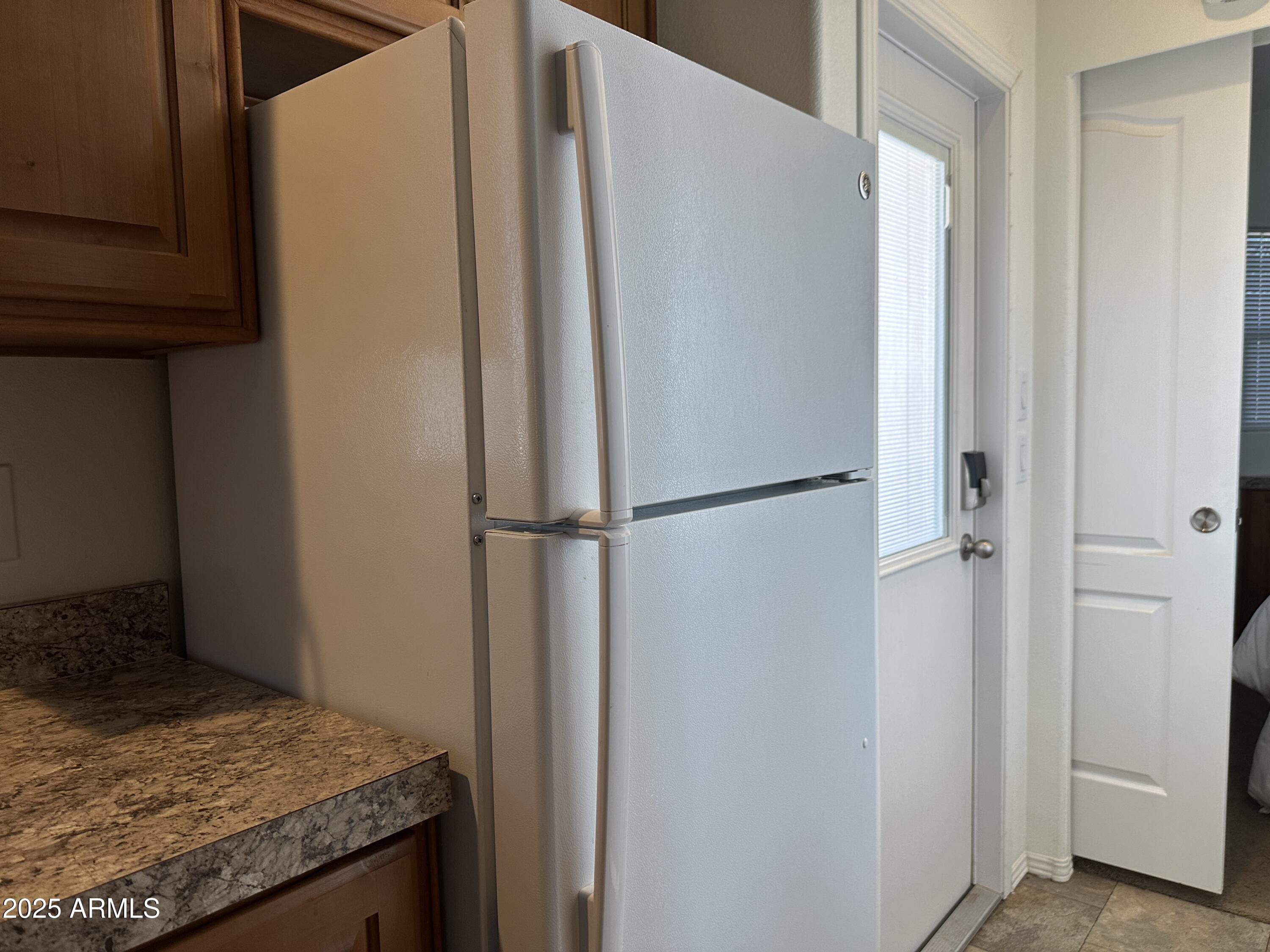 21245 Westward View Road, Unit 248 Congress, AZ 85332 - Photo 10 of 29 Kitchen Refrigerator is full sized