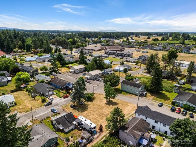 an aerial view of residential building and lake