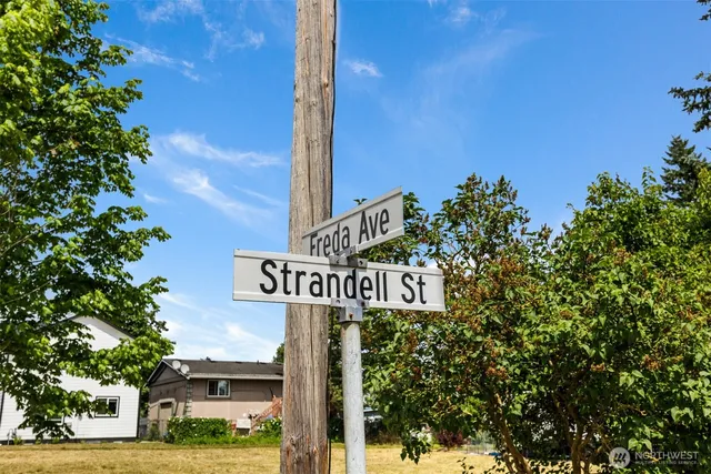 a street sign on a pole on a street
