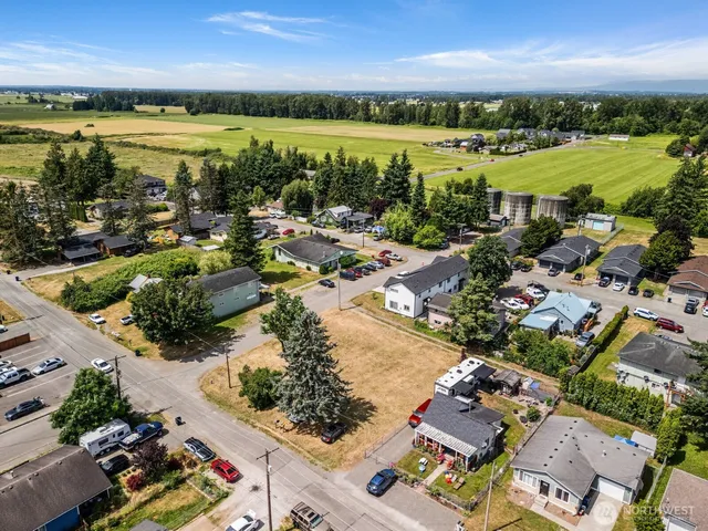 an aerial view of residential building with outdoor space and lake view