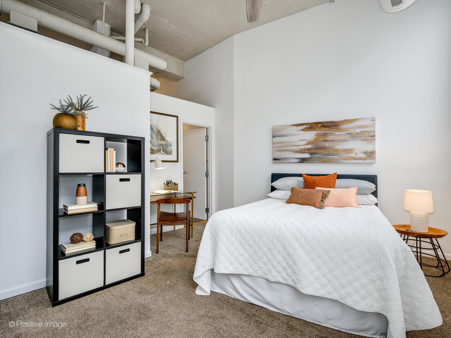 1019 West Jackson Boulevard, Unit 2B Chicago, IL 60607 - Photo 18 of 22 a bedroom with a bed and a book shelf