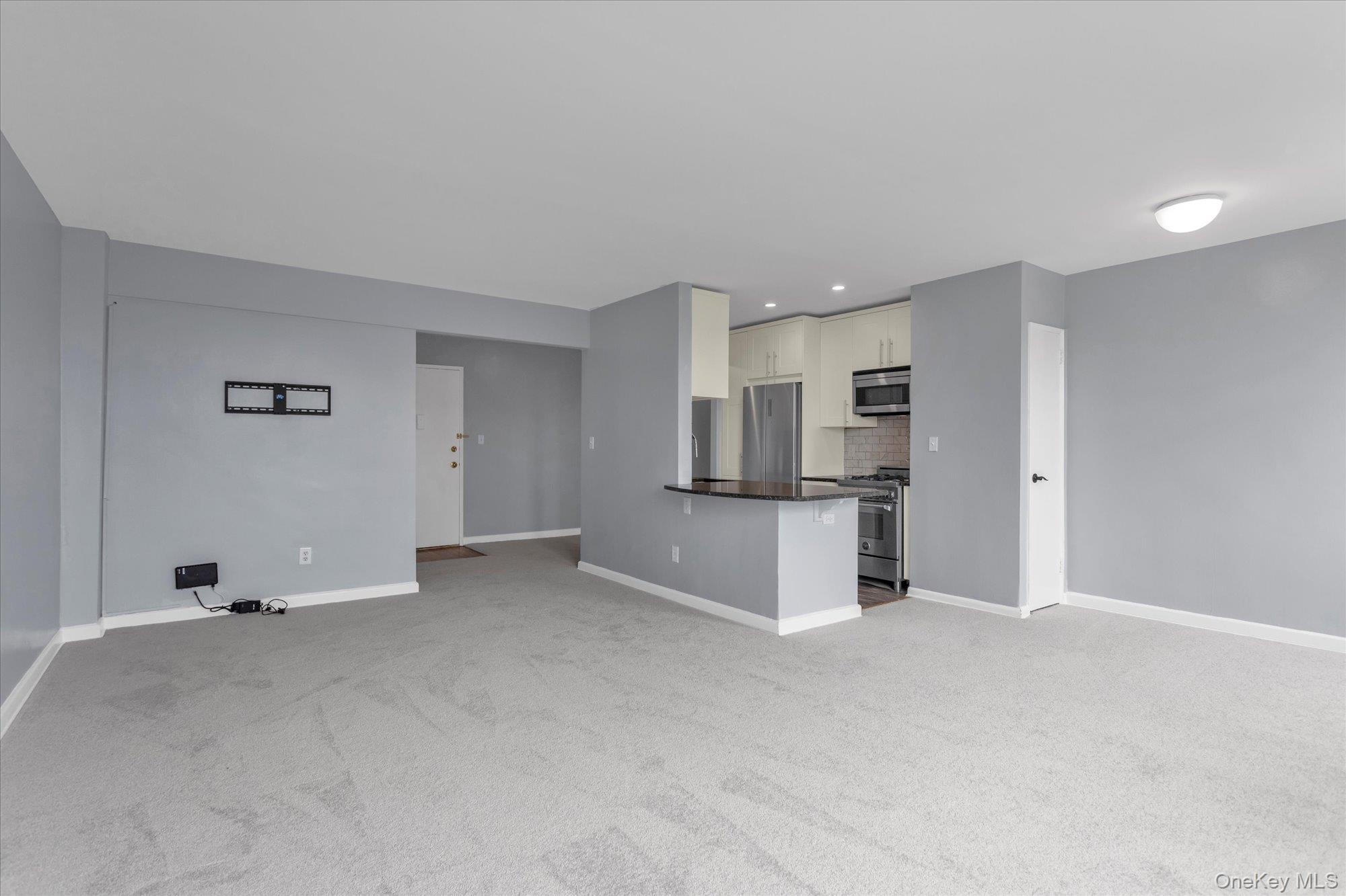 504 Merrick Road, Unit 4J Lynbrook, NY 11563 - Photo 4 of 28 a view of kitchen with refrigerator sink and stove