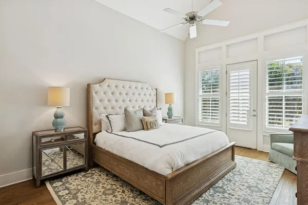 a bedroom with a large bed and a window