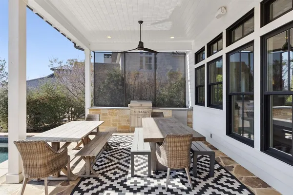 a dining room with furniture and window