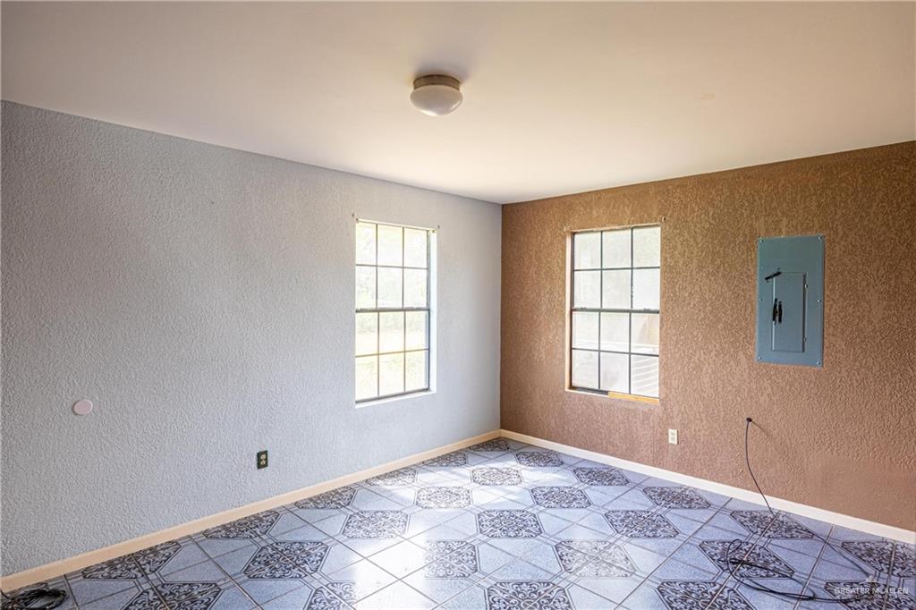 2415 East Expressway 83 Mission, TX 78572 - Photo 13 of 17 a view of an empty room with a window
