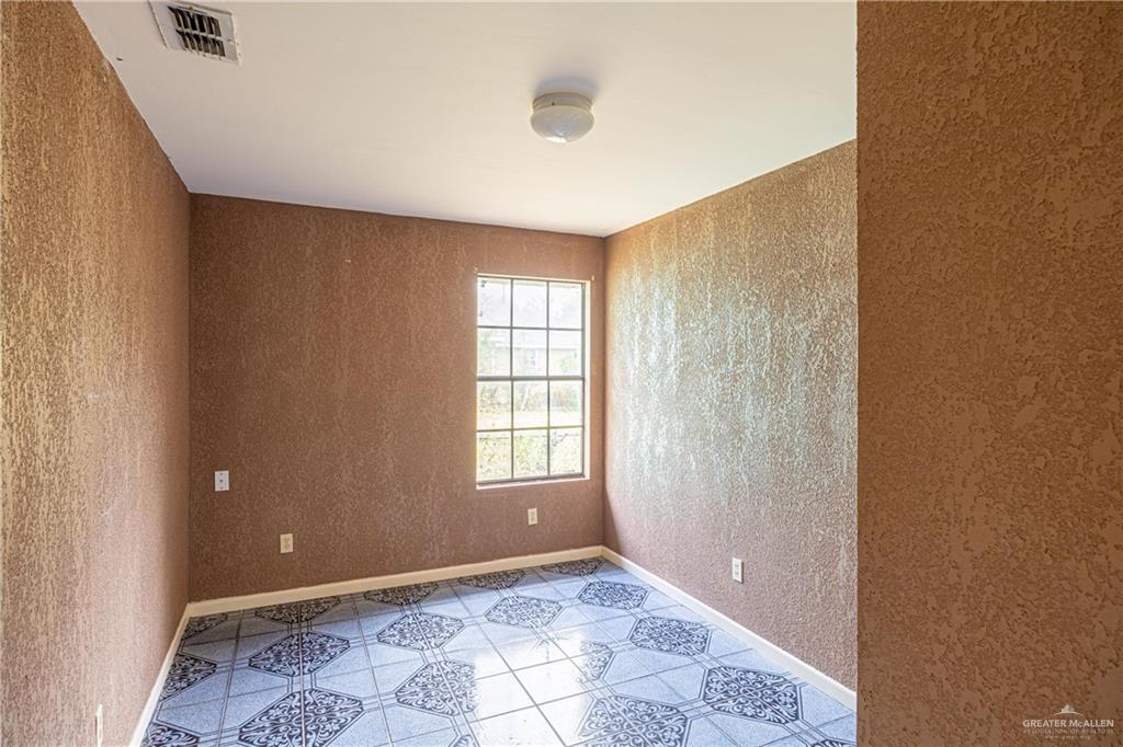 2415 East Expressway 83 Mission, TX 78572 - Photo 14 of 17 a view of an empty room with a window