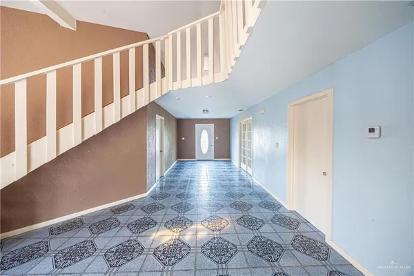 a view of a hallway with windows