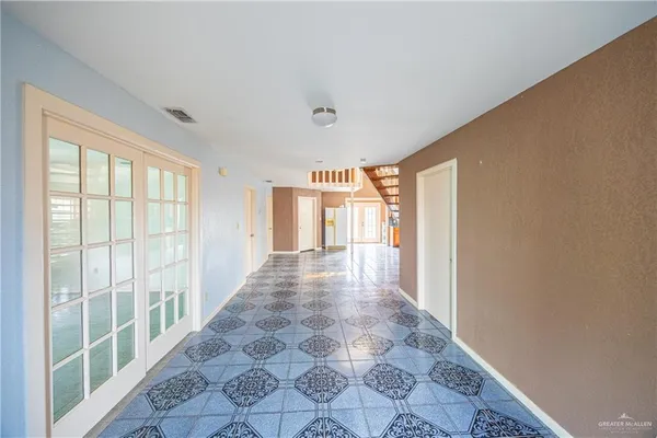 a large kitchen with granite countertop a large stove a sink dishwasher and a stove