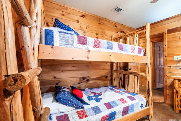 a bathroom with a sink a toilet and shower curtain