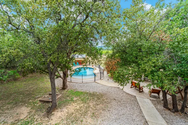 a view of a patio with couches and pool