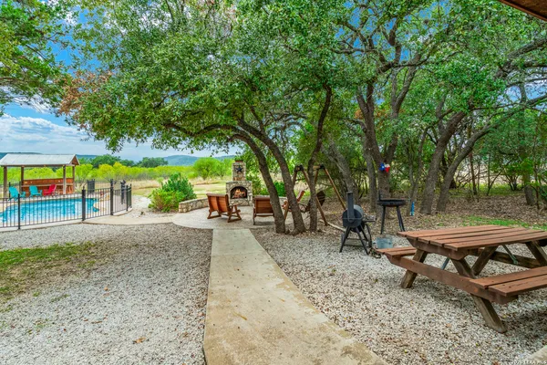 a view of a bench in a backyard
