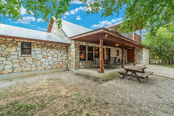 a view of a sitting area in a backyard