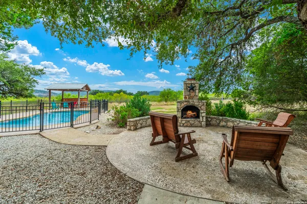 a living room with lots of furniture and a chandelier