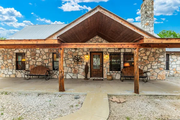 a living room with fireplace furniture and a flat screen tv