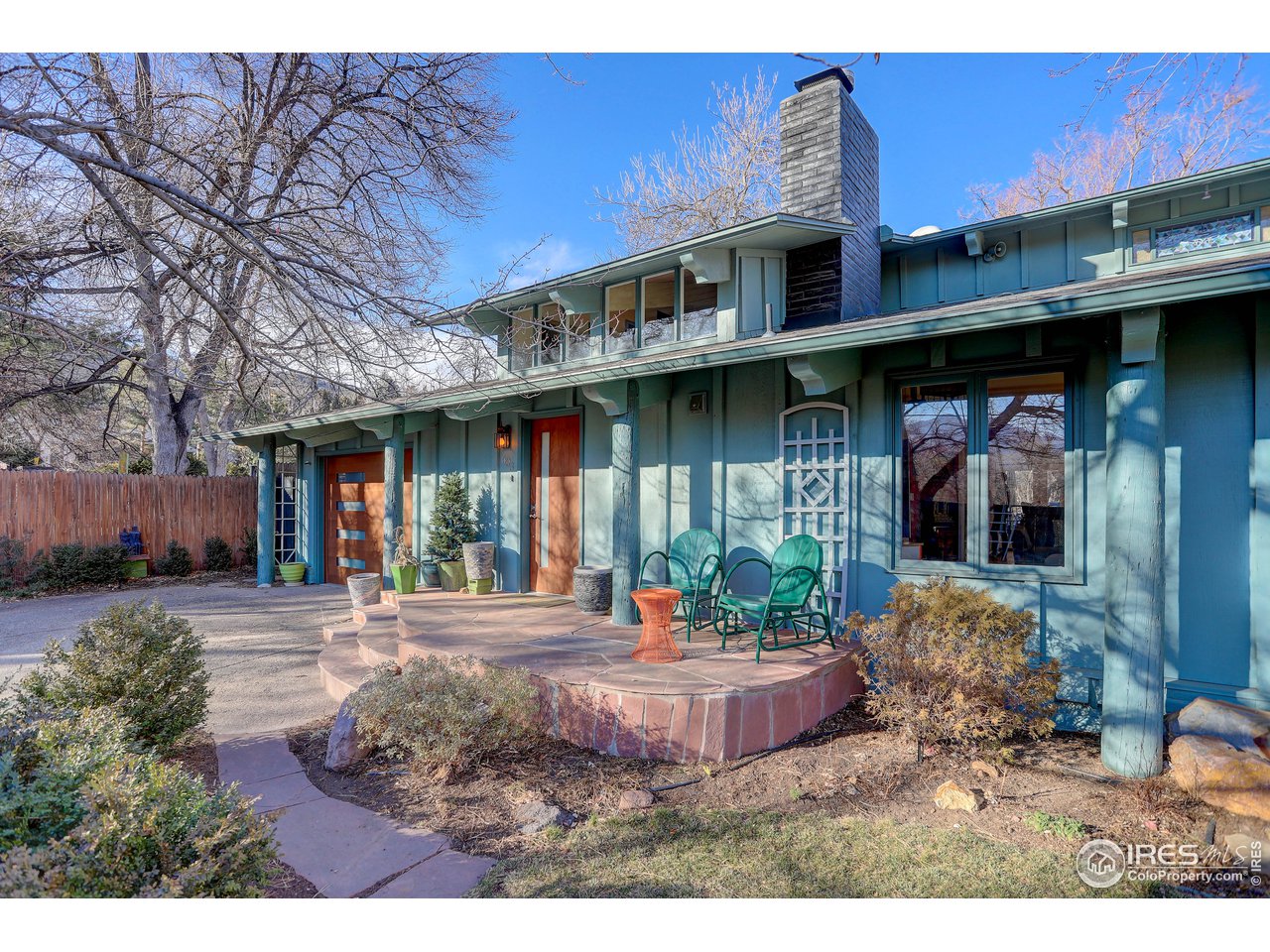 a view of a porch with furniture and yard