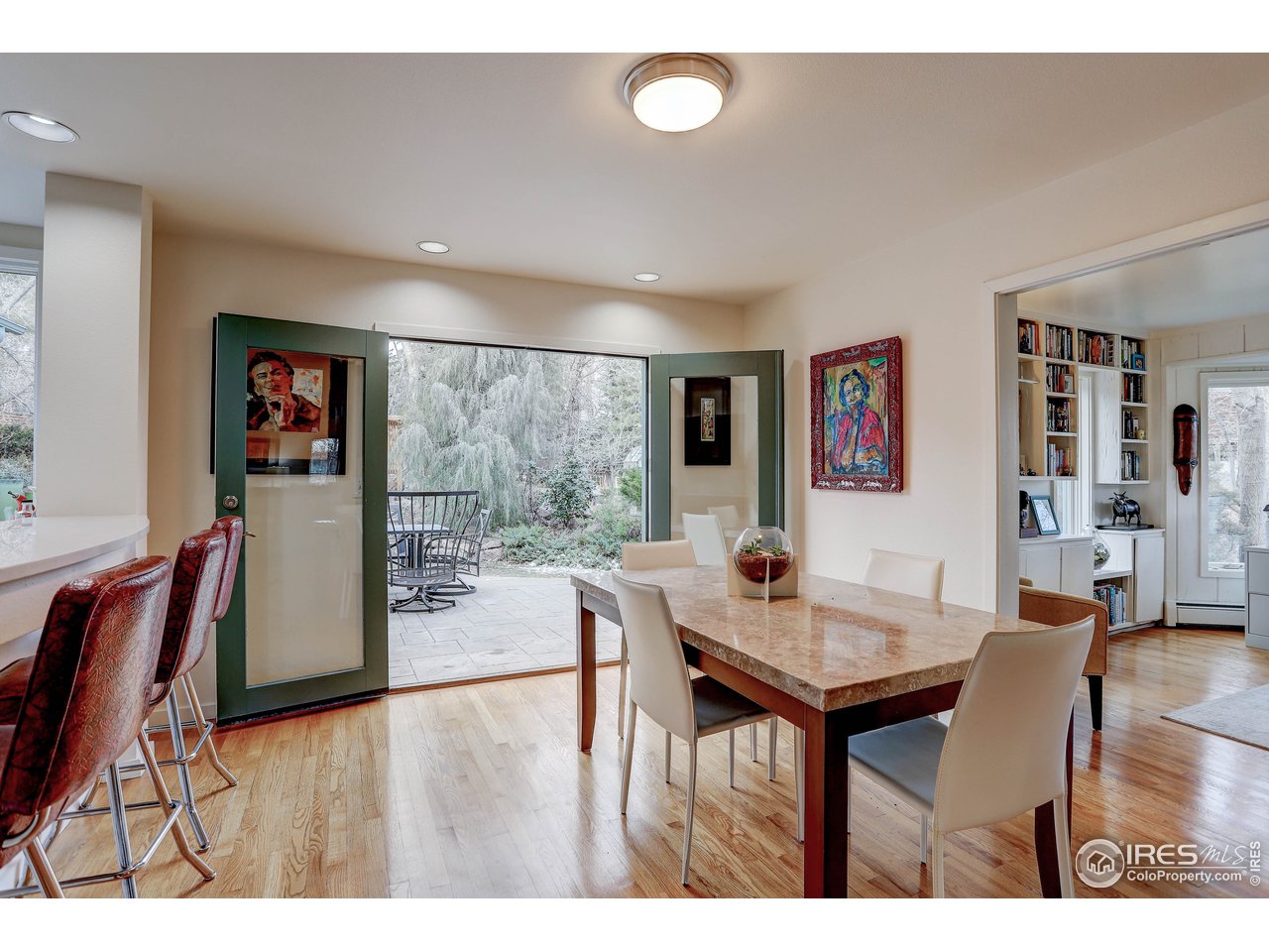 603 Kalmia Avenue Boulder, CO 80304 - Photo 11 of 39 a view of a dining room with furniture and wooden floor