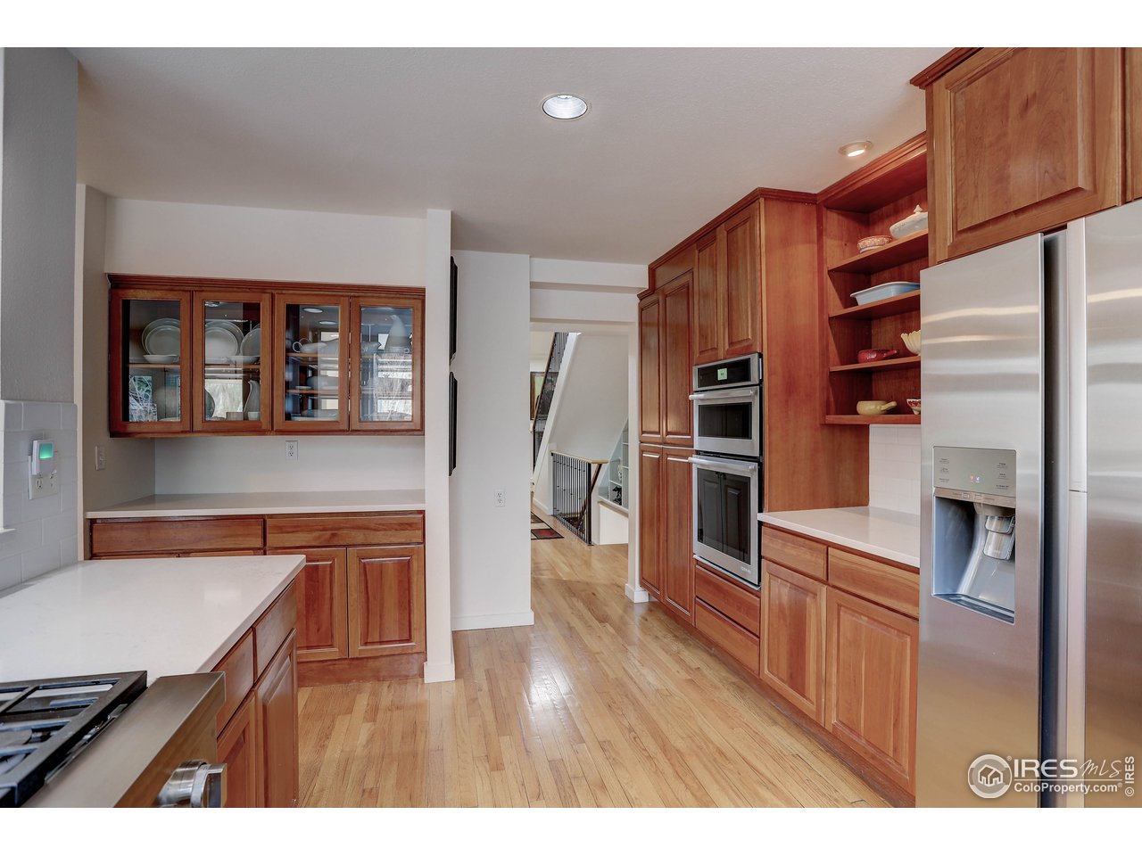 603 Kalmia Avenue Boulder, CO 80304 - Photo 14 of 39 a open kitchen with stainless steel appliances granite countertop a refrigerator a stove and a wooden floors
