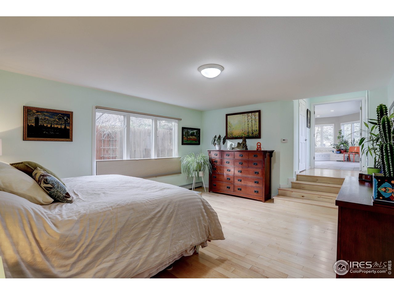 603 Kalmia Avenue Boulder, CO 80304 - Photo 15 of 39 a bedroom with a bed window and a television