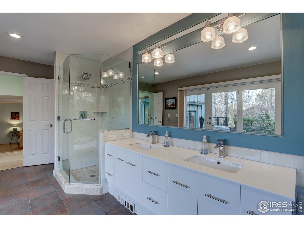 603 Kalmia Avenue Boulder, CO 80304 - Photo 17 of 39 a bathroom with a double vanity sink and a mirror