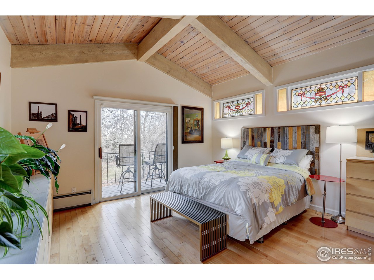603 Kalmia Avenue Boulder, CO 80304 - Photo 20 of 39 a bedroom with a large bed and a potted plant