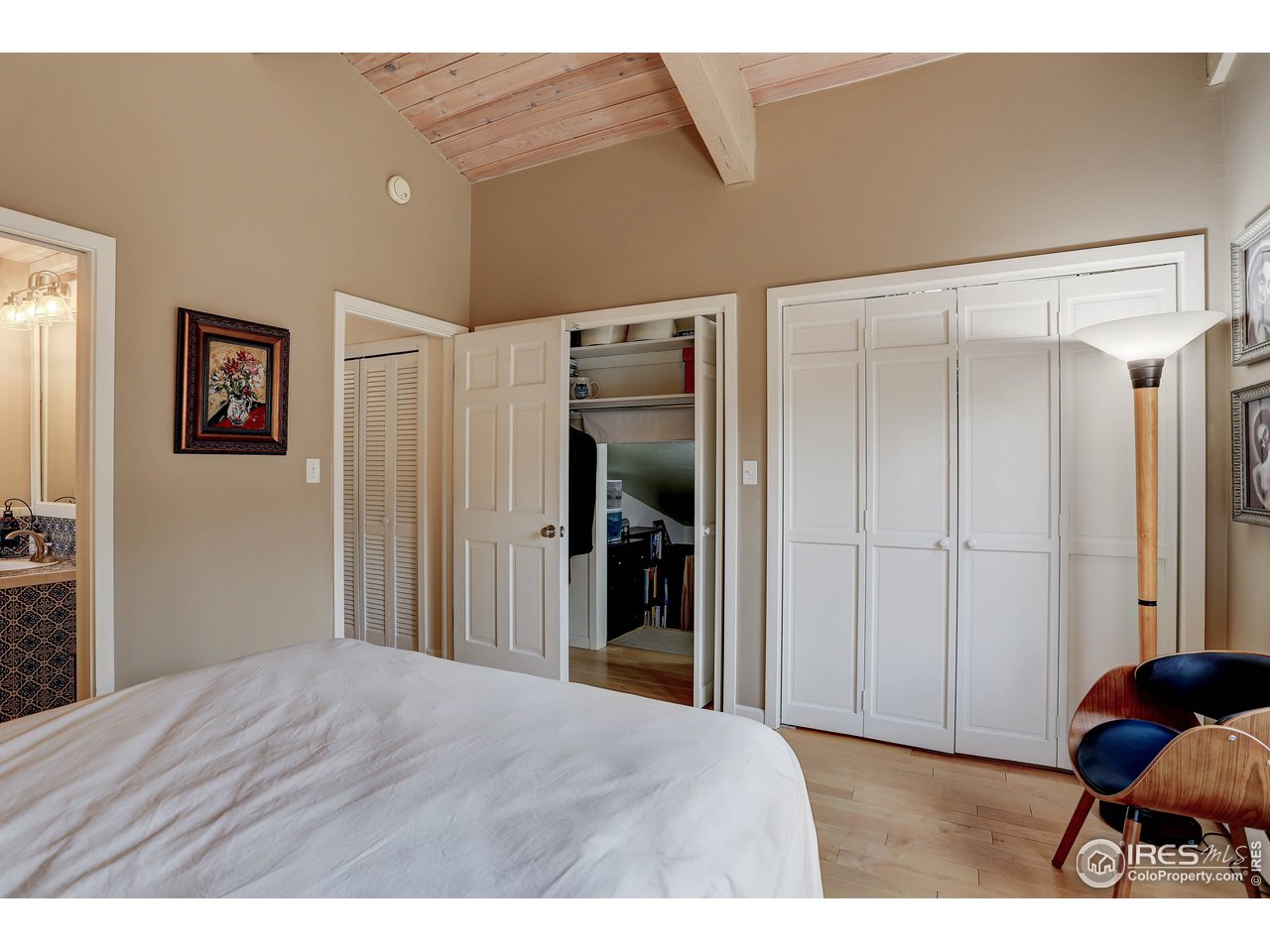 603 Kalmia Avenue Boulder, CO 80304 - Photo 23 of 39 a bedroom with a bed and a painting on the wall