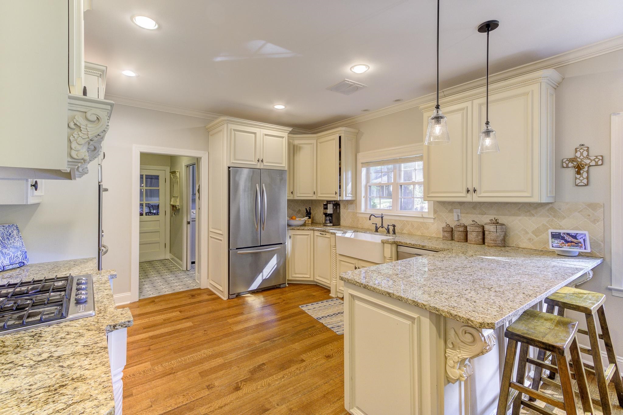 4414 Walnut Grove Road Memphis, TN 38117 - Photo 11 of 40 a kitchen with stainless steel appliances granite countertop a sink refrigerator and cabinets