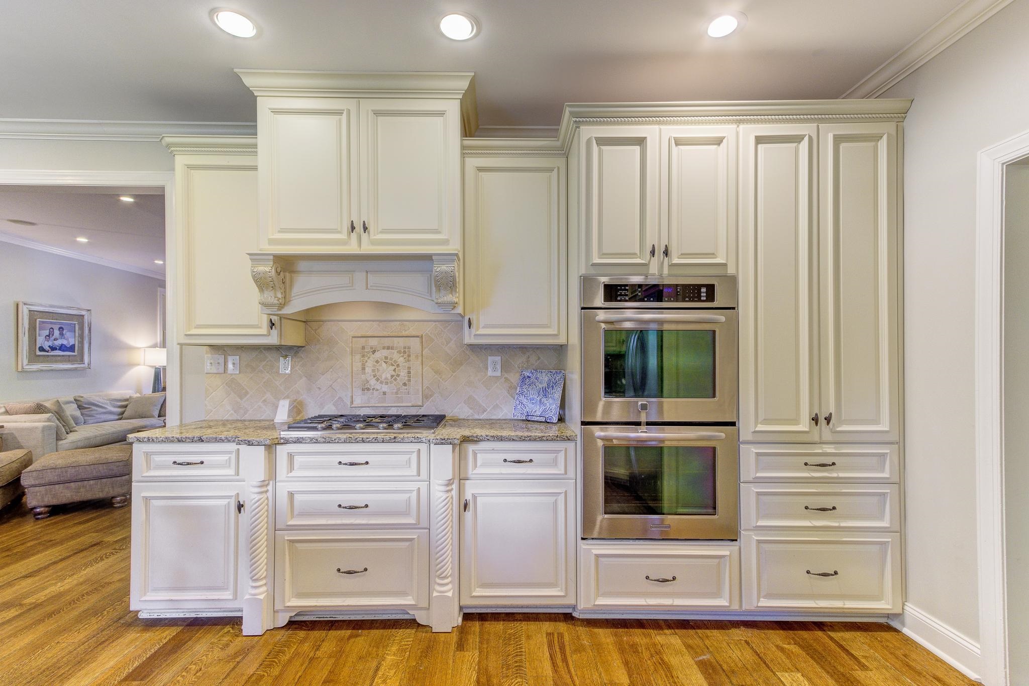 4414 Walnut Grove Road Memphis, TN 38117 - Photo 13 of 40 a kitchen with stainless steel appliances a stove and cabinets