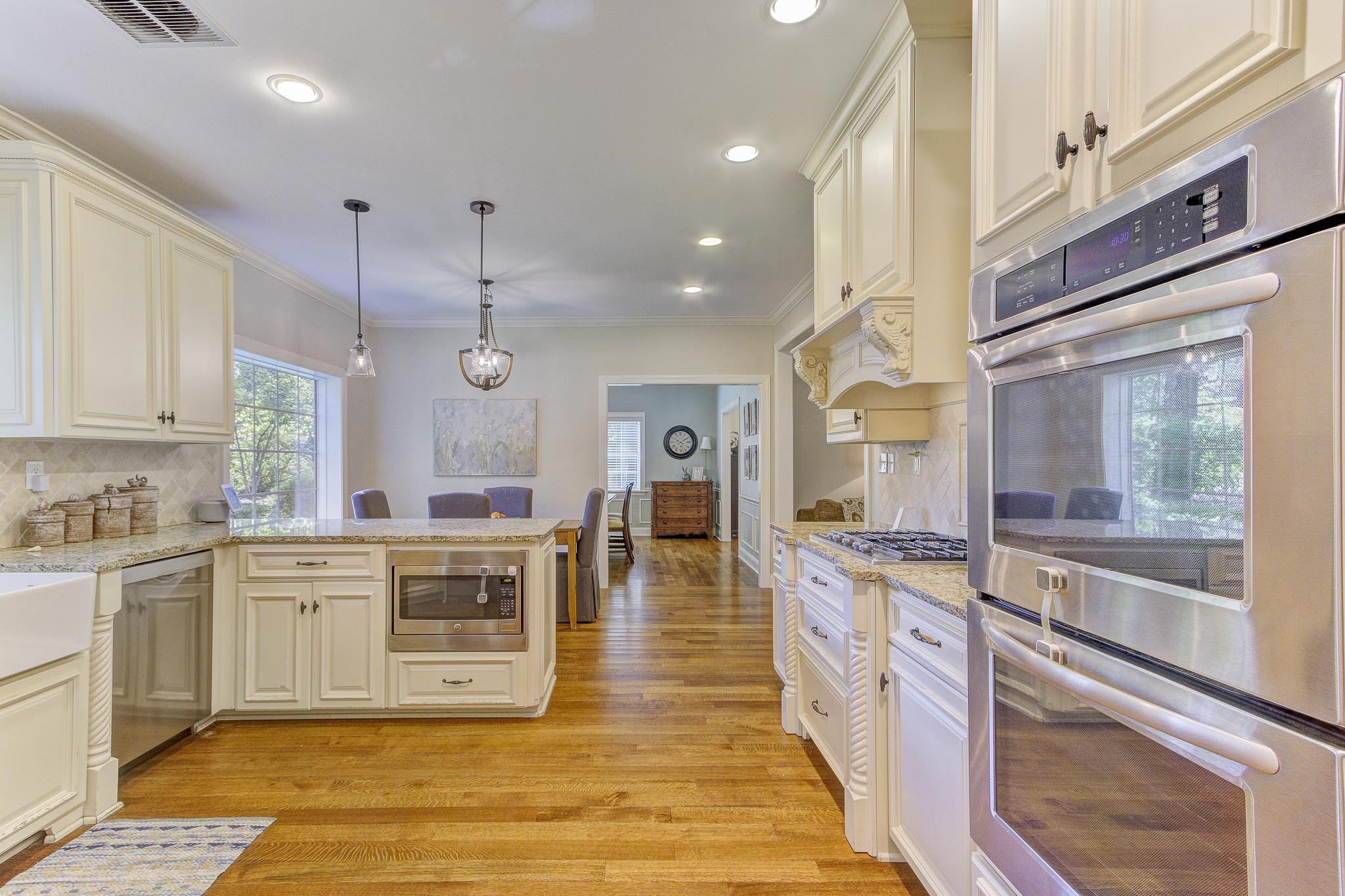 4414 Walnut Grove Road Memphis, TN 38117 - Photo 14 of 40 a large kitchen with stainless steel appliances granite countertop a stove and cabinets