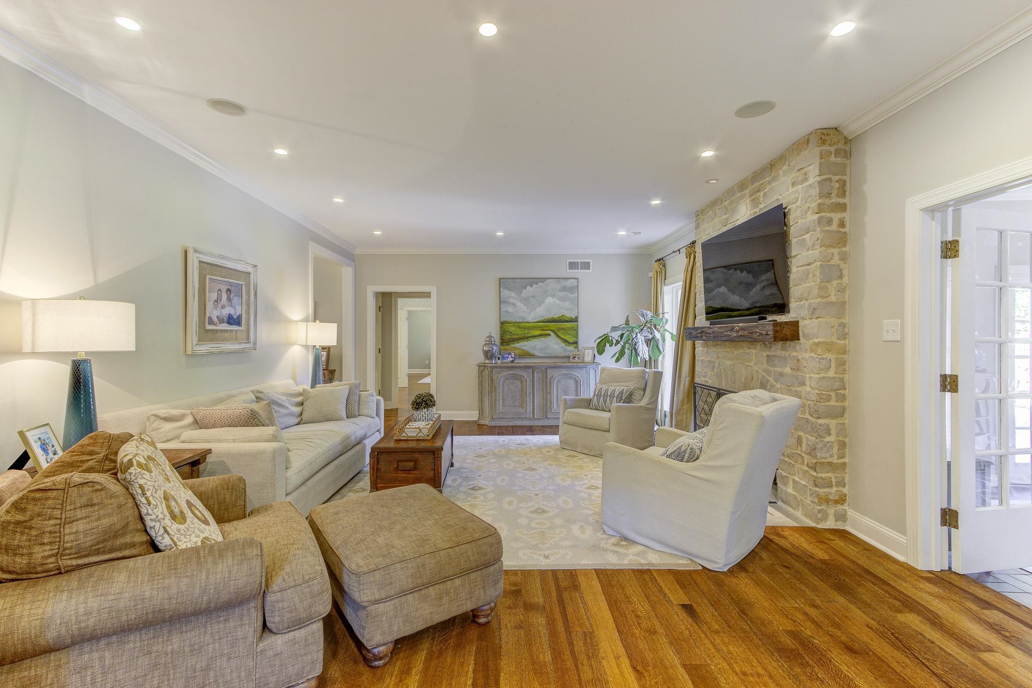 4414 Walnut Grove Road Memphis, TN 38117 - Photo 17 of 40 a living room with fireplace furniture and a flat screen tv