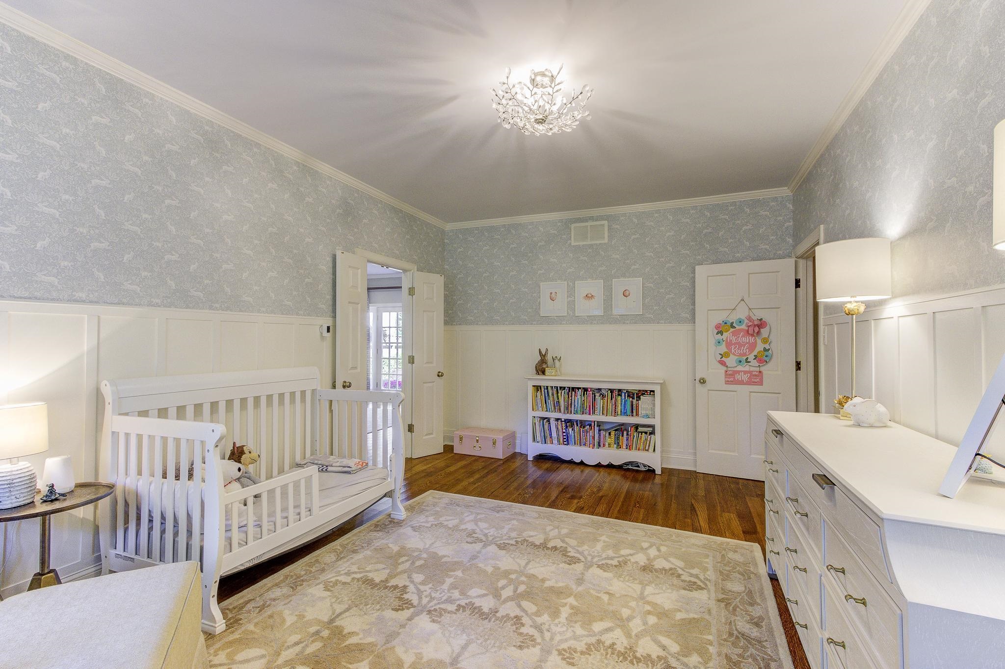 4414 Walnut Grove Road Memphis, TN 38117 - Photo 20 of 40 a bedroom with furniture and baby crib
