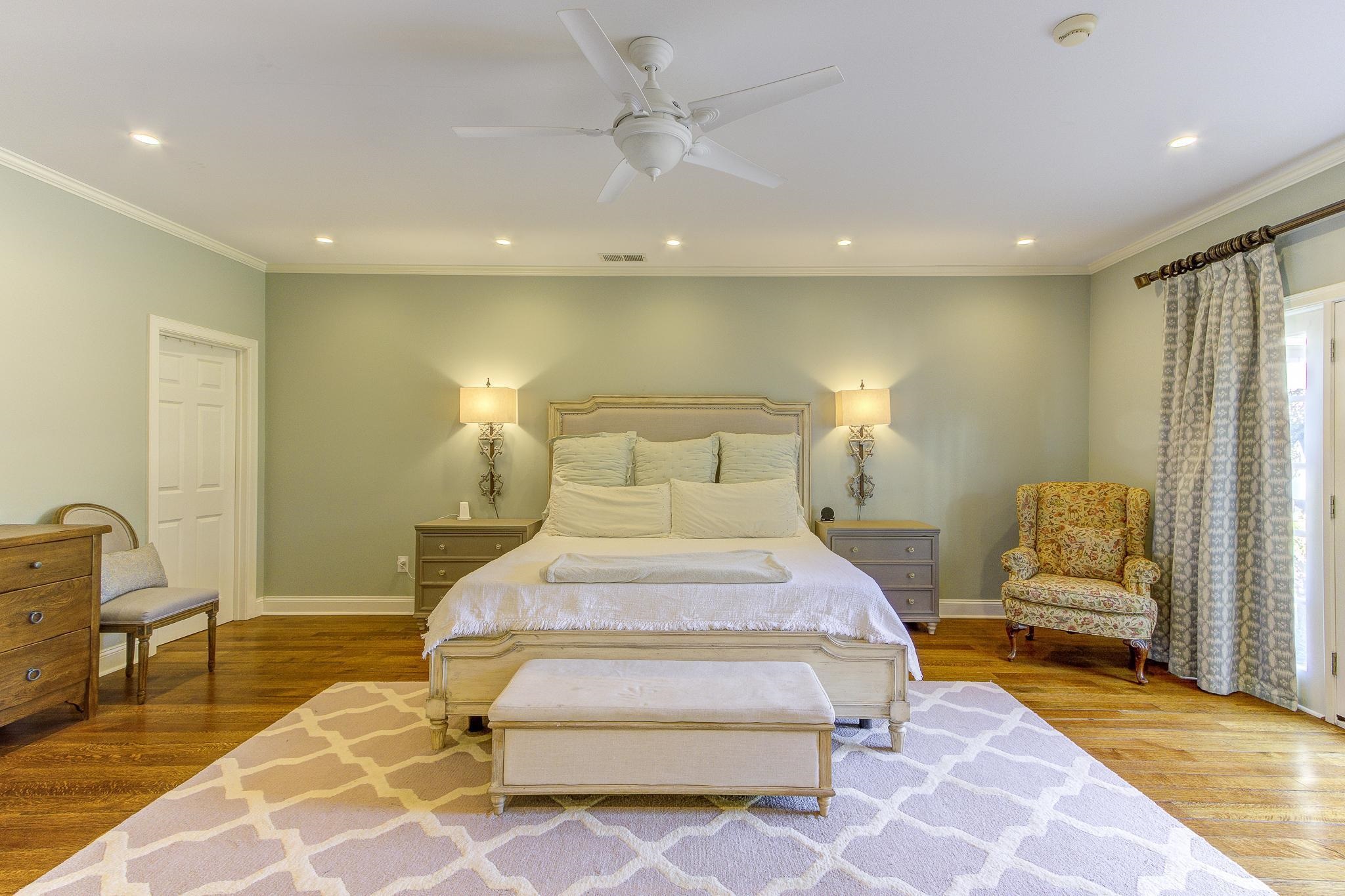 4414 Walnut Grove Road Memphis, TN 38117 - Photo 22 of 40 a spacious bedroom with a bed and glass walk in closet