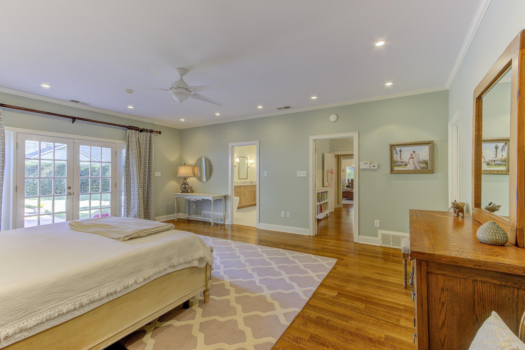 4414 Walnut Grove Road Memphis, TN 38117 - Photo 24 of 40 a spacious bedroom with a large bed and wooden floor