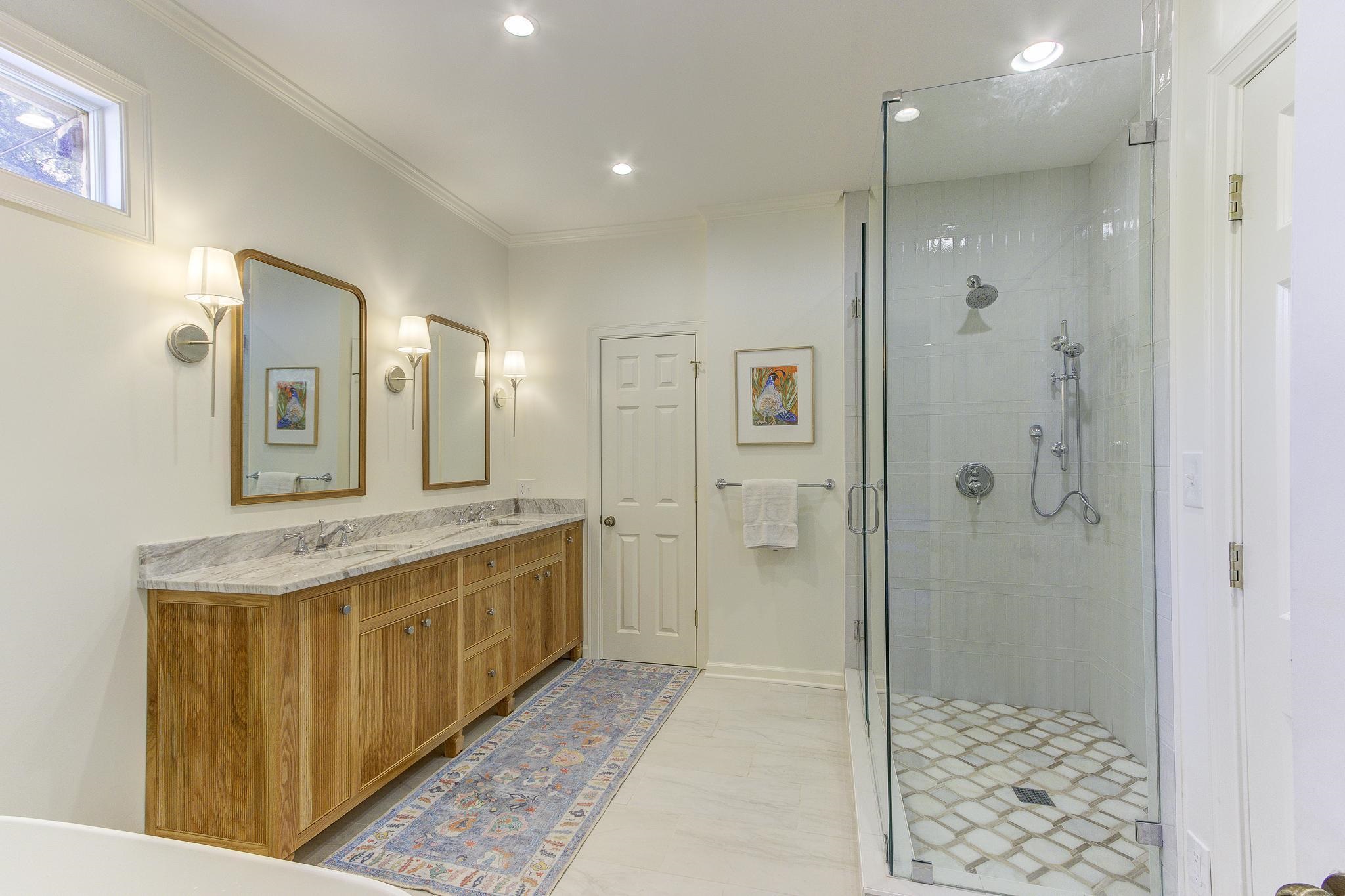 4414 Walnut Grove Road Memphis, TN 38117 - Photo 25 of 40 a bathroom with a granite countertop sink mirror and shower