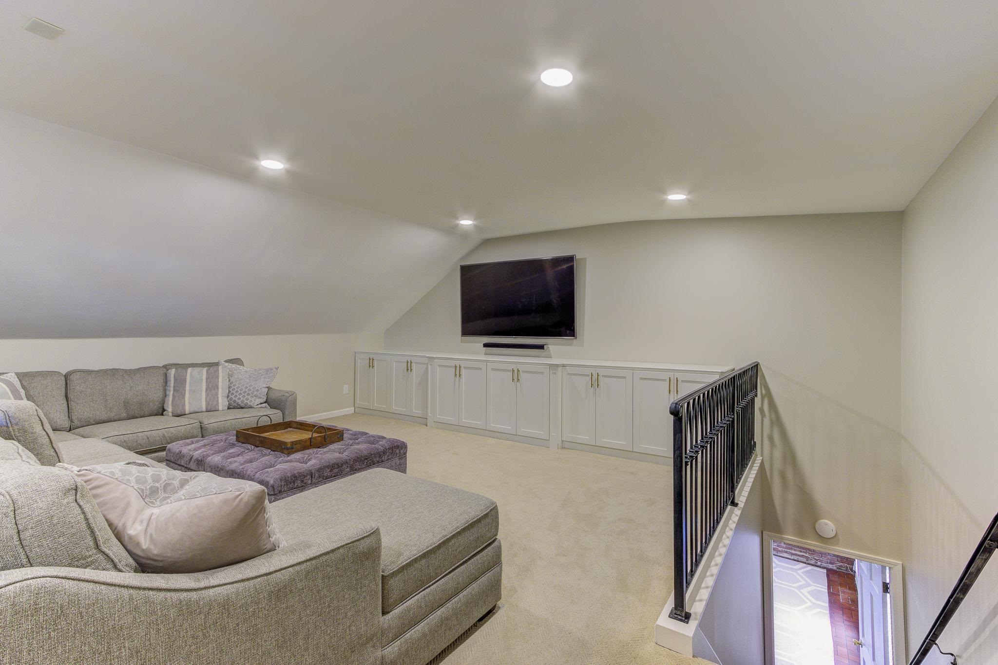 4414 Walnut Grove Road Memphis, TN 38117 - Photo 30 of 40 a living room with furniture and a flat screen tv