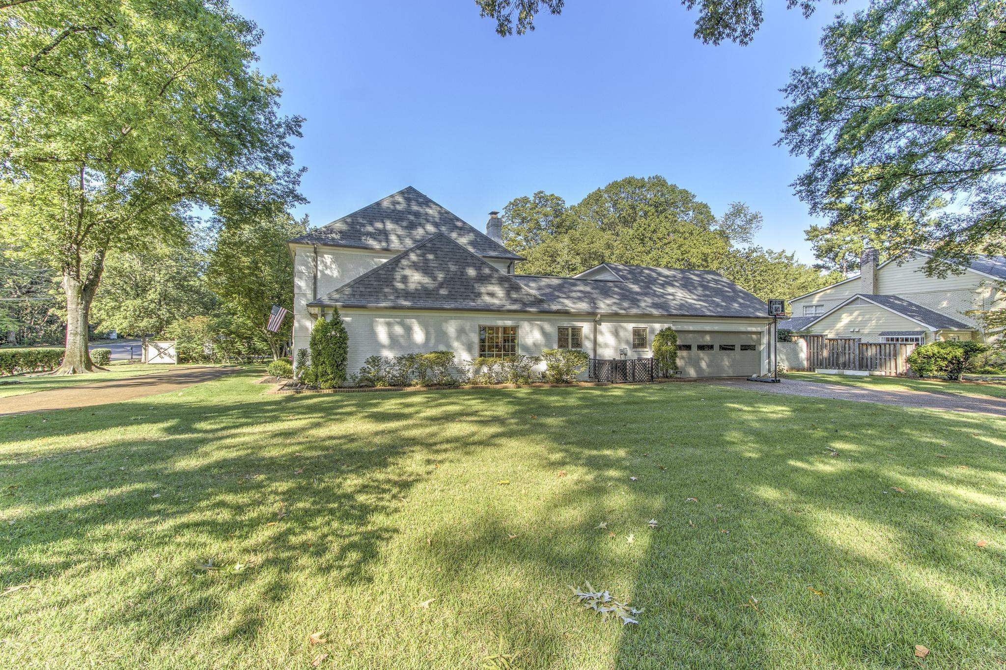 4414 Walnut Grove Road Memphis, TN 38117 - Photo 3 of 40 a front view of a house with a garden