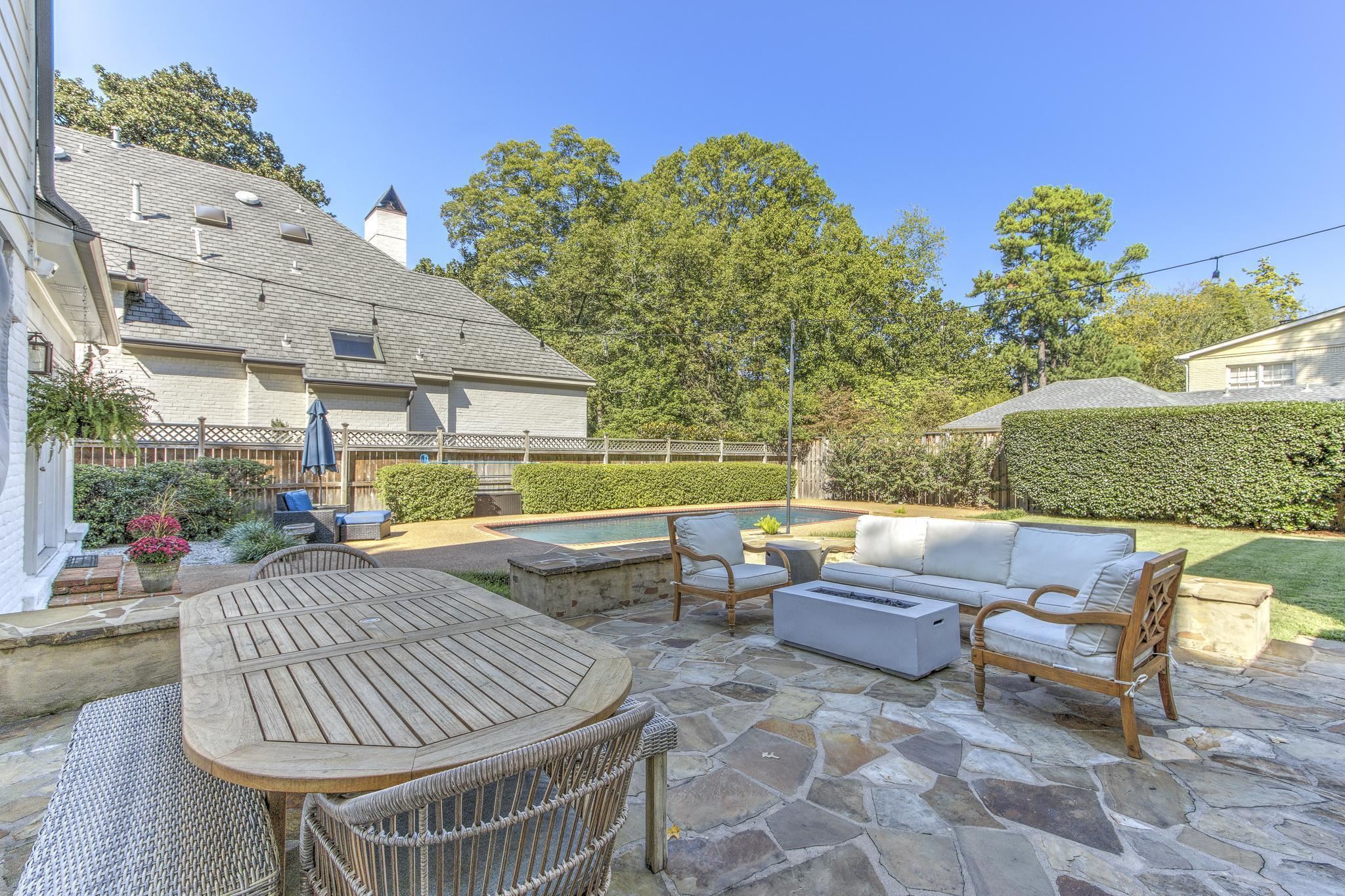 4414 Walnut Grove Road Memphis, TN 38117 - Photo 37 of 40 a view of patio with couches table and chairs and potted plants