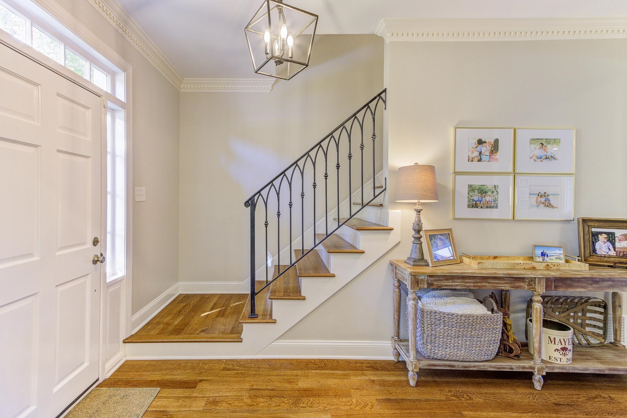 4414 Walnut Grove Road Memphis, TN 38117 - Photo 4 of 40 a view of a livingroom with furniture hardwood floor and staircase