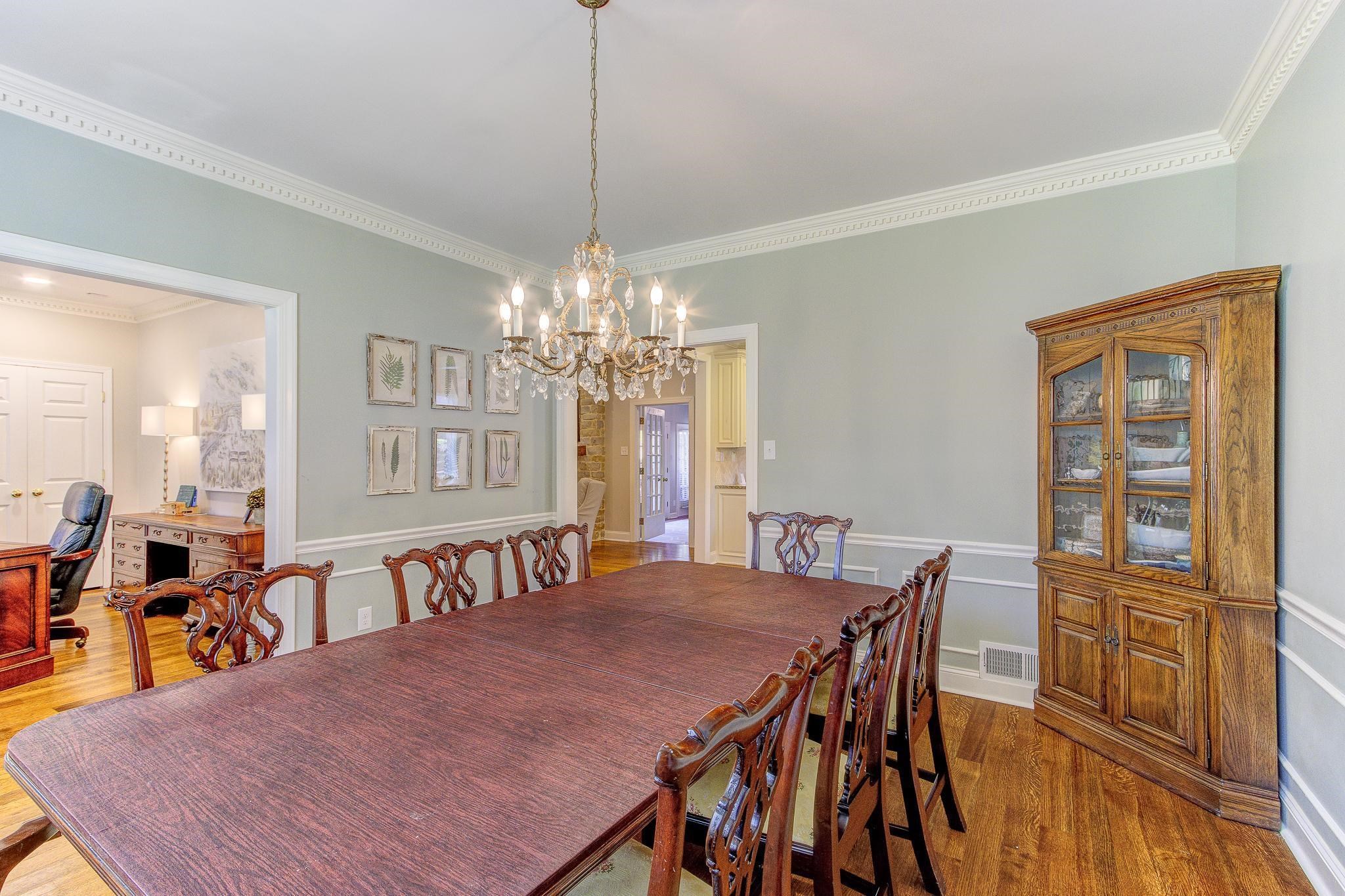4414 Walnut Grove Road Memphis, TN 38117 - Photo 8 of 40 a view of a dining room with furniture a chandelier and wooden floor