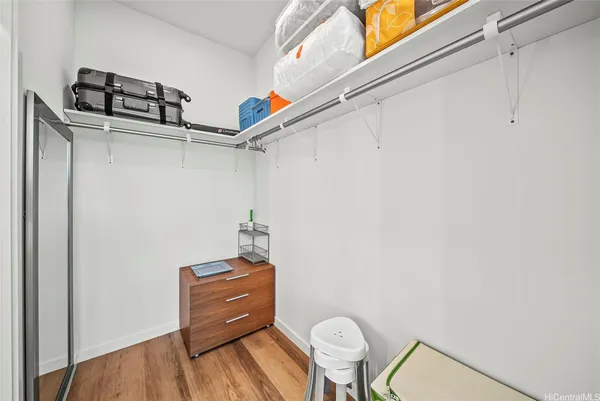 a room with a chair and wooden floor