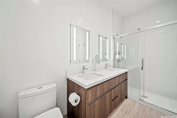 a bathroom with a sink a toilet and vanity